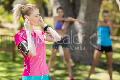 Fit young women warming up standing