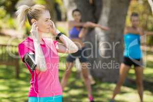 Fit young women warming up standing