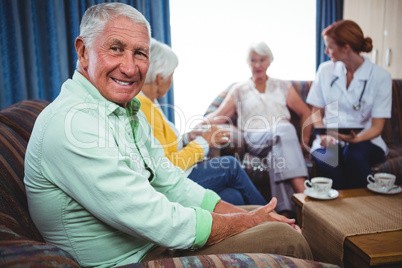 Portrait of a smiling retired man looking at the camera