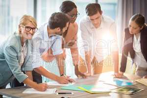 Group of business people discussing at desk