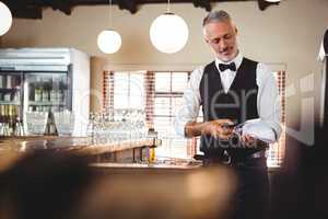 Bartender cleaning wineglass