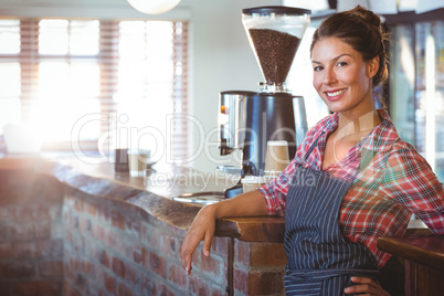 Waitress leaning against counter