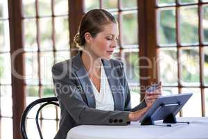 Woman holding tablet and credit card