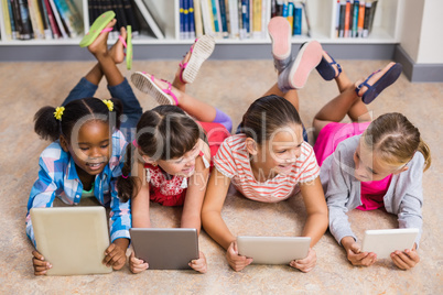 Kids using digital tablet in library