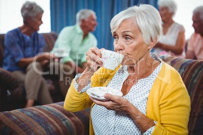 Senior woman drinking a cup of coffee