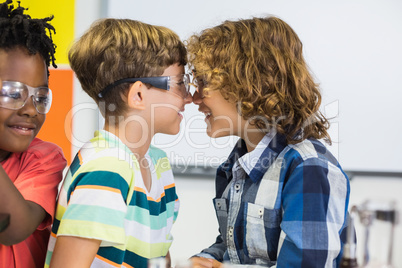 Kids rubbing their nose in classroom