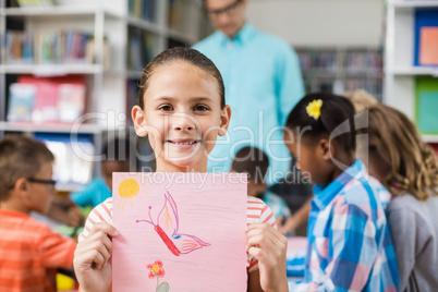 Schoolgirl showing her drawing