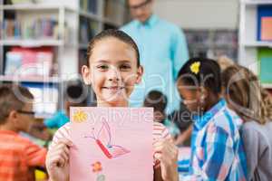 Schoolgirl showing her drawing