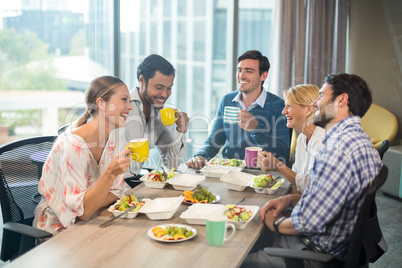 Business people having breakfast