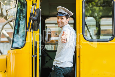 Bus driver showing thumbs up while entering in bus