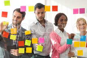 Business people sticking adhesive notes