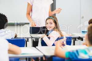 Schoolgirl smiling in classroom