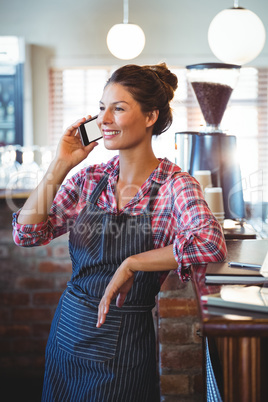 Waitress making a phone call