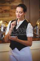 Waitress taking order on a notebook