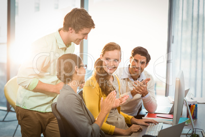 Business people clapping hands in the meeting