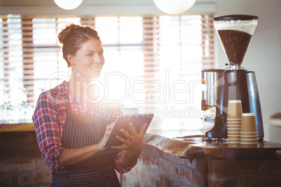 Waitress writing in a book Waitress writing in a book