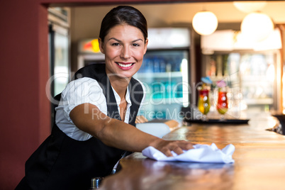 Waitress cleaning the counter