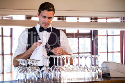Bartender cleaning wineglass