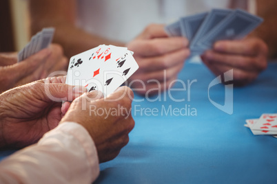 Retired people playing card