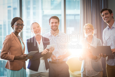 Business people interacting using mobile phone, digital tablet a