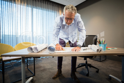 Man working on blueprint