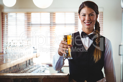 Waitress holding a beer