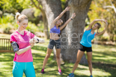 Fit women warming up standing