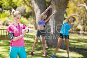 Fit women warming up standing