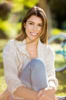 Beautiful woman sitting in park