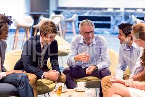 Business people having a discussion in cafeteria