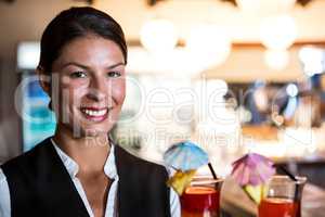 Waitress holding cocktails