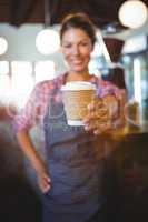 Waitress holding a cup of coffee