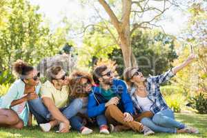 Group of friends taking a selfie with the mobile phone