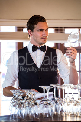 Bartender examining a clean wine glass