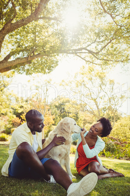 Couple posing with a dog