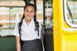 Portrait of schoolgirl looking from bus