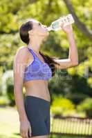 Woman drinking water from water bottle