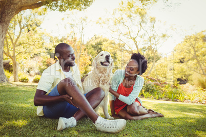 Couple posing with a dog