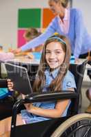 Disabled schoolgirl using digital tablet