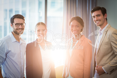 Businessmen and businesswomen posing together