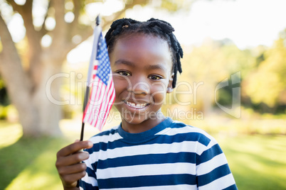 happy child showing usa flag