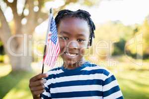 happy child showing usa flag