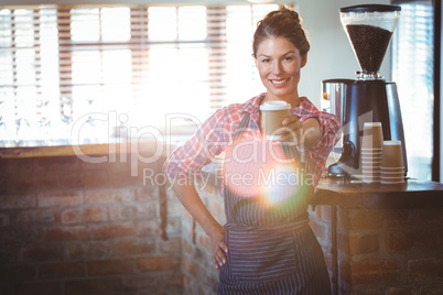 Waitress holding a cup of coffee