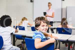 Smiling boy looking at camera during lesson
