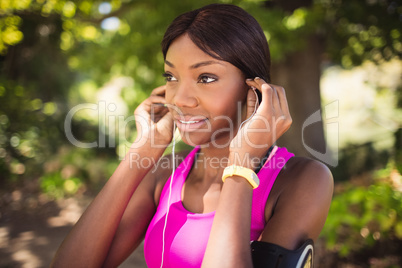 Sporty woman listening music