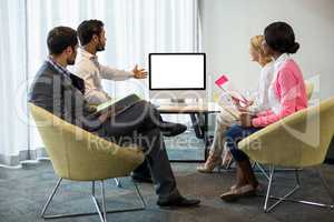 Business people looking at a screen during a video conference