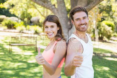 Portrait of couple standing back to back