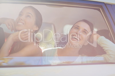 Beautiful women looking out from car window