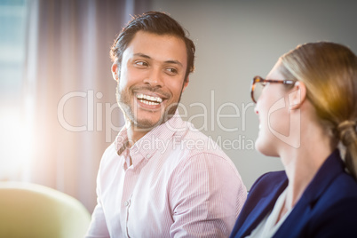 Businesswoman interacting with a colleague