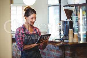 Waitress writing in a book